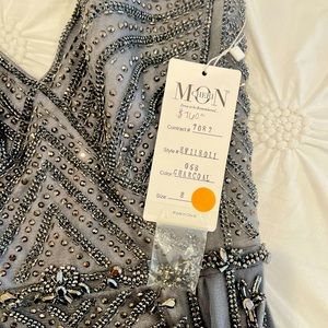 Beautiful charcoal and silver dress never been used.